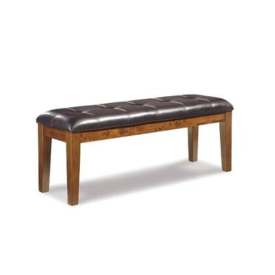Signature Design by Ashley Ralene Tufted Upholstered Dining Room Bench, Medium Brown | Plush wipe-clean faux leather cushion, Frame of veneers, wood and engineered wood, Versatile 2-person entryway seating