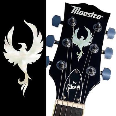 Phoenix Bird Sticker by Inlay Sticker's Jockomo | White Pearl rising phoenix decal for guitar headstocks, with a crisp crest-like silhouette and pearl-style inlay look.