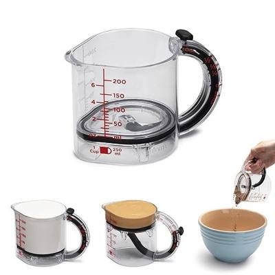 Dreamfarm Upcup All-in-1 Adjustable Measuring Cup, Metric & Imperial Measurements up to 1 Cup - Black/Clear | Measures dry and liquid ingredients and scrapes itself clean, easy-to-read metric and imperial measurements, microwave safe