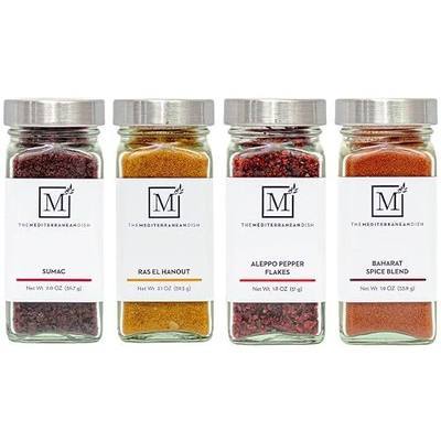 The Mediterranean Dish Exotic Middle Eastern Spice Bundle - Baharat, Ras El Hanout, Aleppo Pepper and Sumac - Gourmet Mediterranean Seasonings Set - Warm, Tangy and Aromatic Blends - Set of 4 Glass Bottles